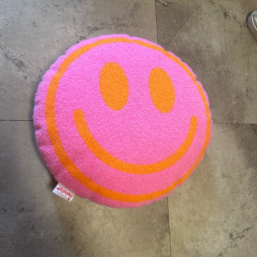 Pink and orange smiley face pillow!